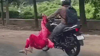 Man Seen Dragging Woman Clinging To His Motorcycle