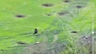 Russian motorcyclist soilder drives over mine.