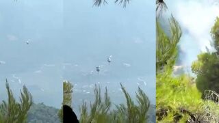 Two killed after firefighting helicopters collide in Greece.