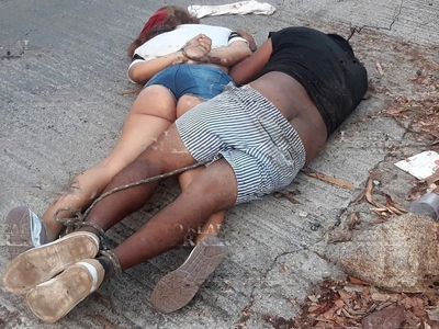 Young Couple Found Garroted in the Street