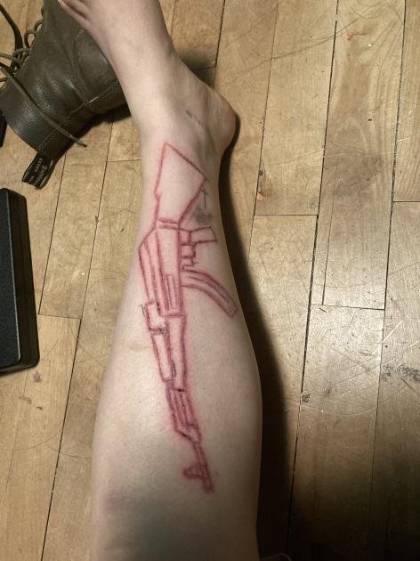 AK-47 carved into my leg