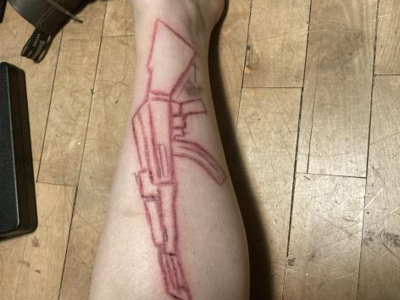 AK-47 carved into my leg