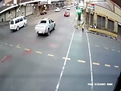 Crashing car takes out pedestrian.