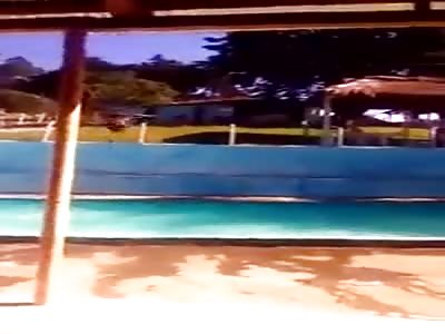 Man trying to show off and jump in the pool, fails