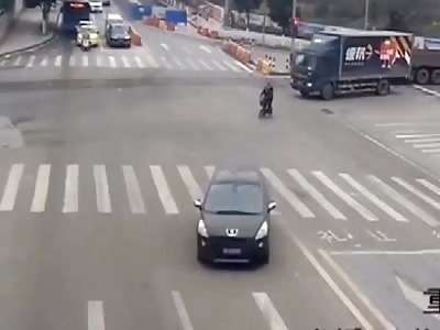 Chinese biker luckily survives...