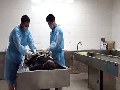 Dead woman is washed in morgue 1
