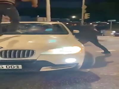Russian hooligans attack car driver