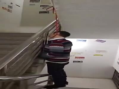 Man Hanging in Stairwell
