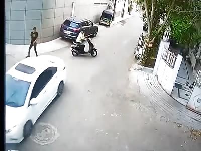 Watch moment furious motorist rams into scooter rider