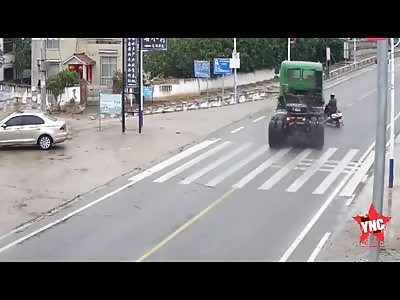 Scooterist causes a truck to crash