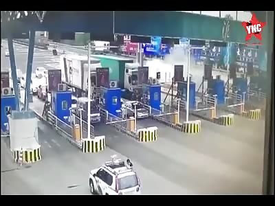 The car crashes into a toll booth