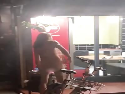 Crazy naked hippy attacks diners with a bottle.