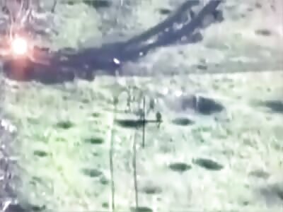 Grenade dropped by a Ukrainian drone lands in the center of a Russian group.