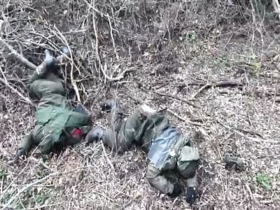 Ukrainian soldier kicks a dead Russian body