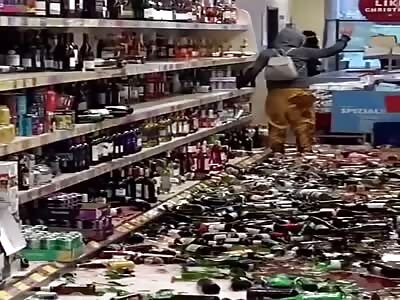 Damn: Chick on a rampage in the liquor store