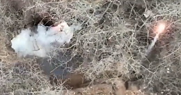A small trenchline ammo cache gets cooked off by a UA drone bomb