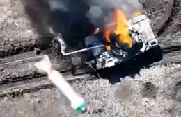 UA UAV engages a RU soldier next to his burning tank