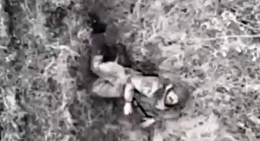 A Russian drone drops a grenade on a lone UA soldier