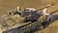 Ukrainian drone crawls into an open tank hatch