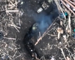 A Ukrainian VOG grenade falls into a Russian trench