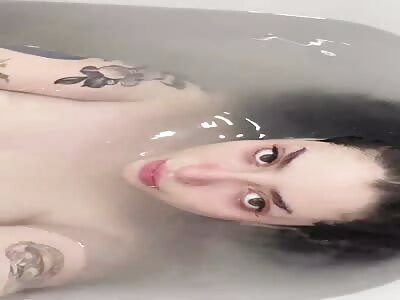 Busty girl in the bathtub
