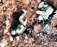Grenade drop on two Russian soldiers in a small dugout