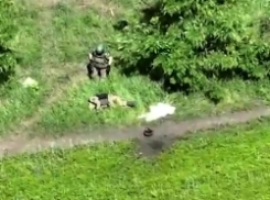 Ukrainian drone munition drops on Russian soldiers