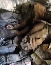 Ukrainian soldiers show dead ORCs in a dugout