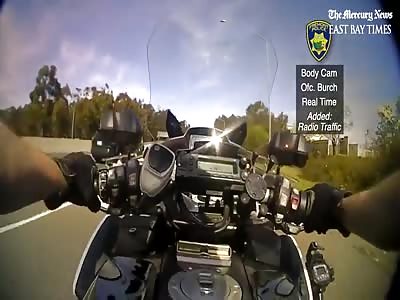 MOTORCYCLE COP SHOOTS SUSPECT