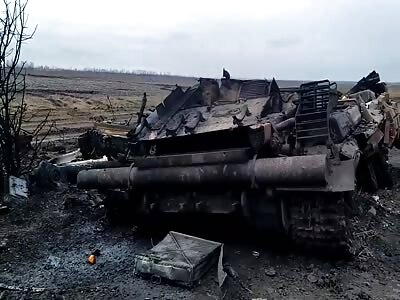 Destroyed Tank and Charred Soldiers