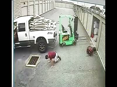 Man crushed between pick up and forklift 