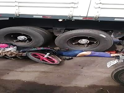 Man with his pink motorcycle is crushed by truck