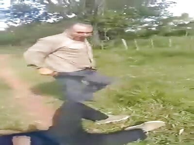 Elderly man assaults a man lying on a grass