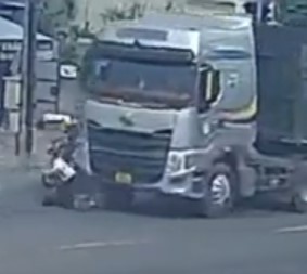 woman thrown under truck