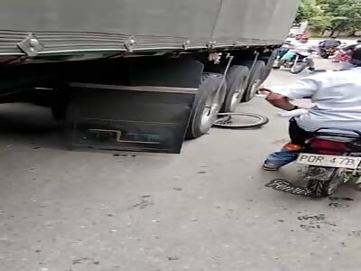 man is cut into two pieces by a truck