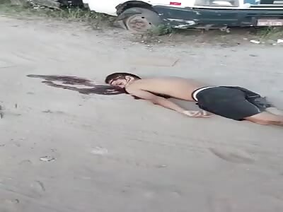 Sortly after being killed a man's corpse is filmed on the ground in Brazil,