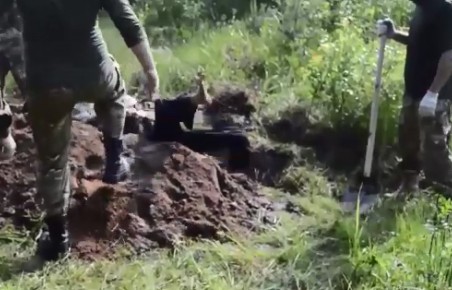 Shocking Video Shows Man Being Buried Alive in Ukraine