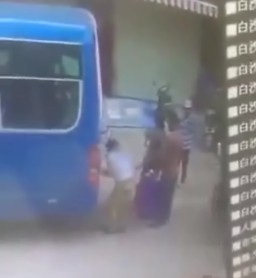 CCTV Captures Man Being Pressed Between Bus and Truck