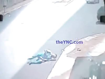 Biker Hits his Head on the Curb and goes into Convulsions on the Street 