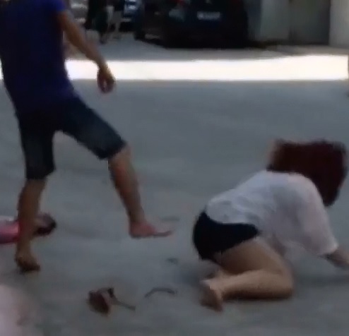Man Stomping his Wife in the Middle of the Street..Mo one Helps Her 