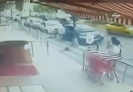 Baby Falls from Building in Front of Woman out for a Stroll in the Street