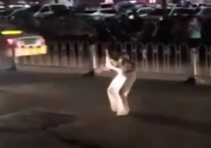 Crazy Woman Dances over the Corpse of the Man She just Killed with Her Car (Different Video)