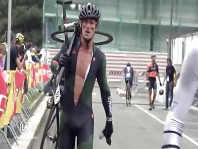 Pissed off cyclist touchdown spikes his bike in half during race