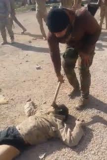 Iraqi soldier with Axe vs daesh head