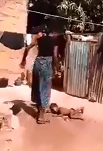 Hard to Watch Video of Mom Beating her Little Baby in the Dirt 