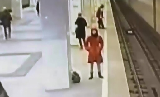 The Lady in Red...Woman Ends her Life in Front of Subway Train 