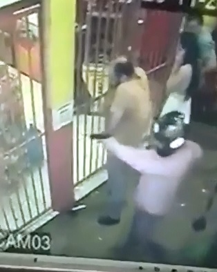 Helmet Wearing Hitman Executes Man through Iron Bars while Working 