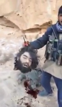 ISIS Fighter Dies in Captors Arms ... So what Better Thing to Do than Mutilate Corpse