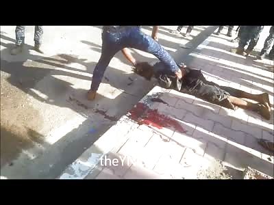 Angry Iraqi Hacks the Head off of of ISIS Member on the Curbside 