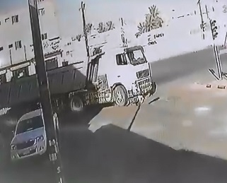 Poor Man on a Scooter Literally cant Help Himself as he Falls Underneath a Giant Industrial Truck 